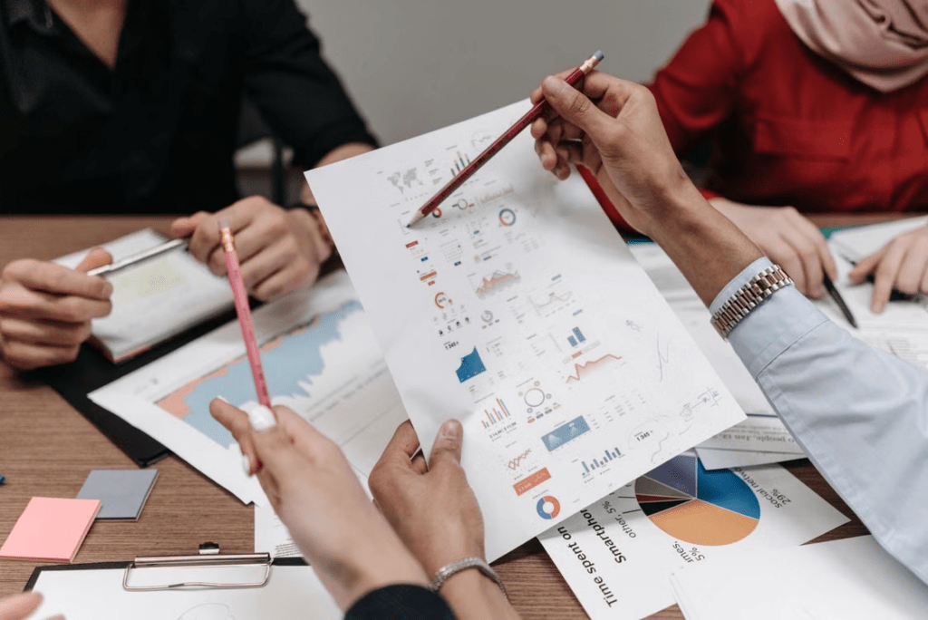 Person planning investment goals and choosing between different account types for short-term and long-term savings.